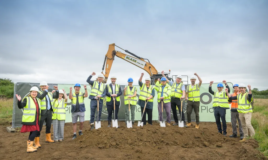 Group image of OX Place team members with spades celebrating the groundbreaking at Mill Lane