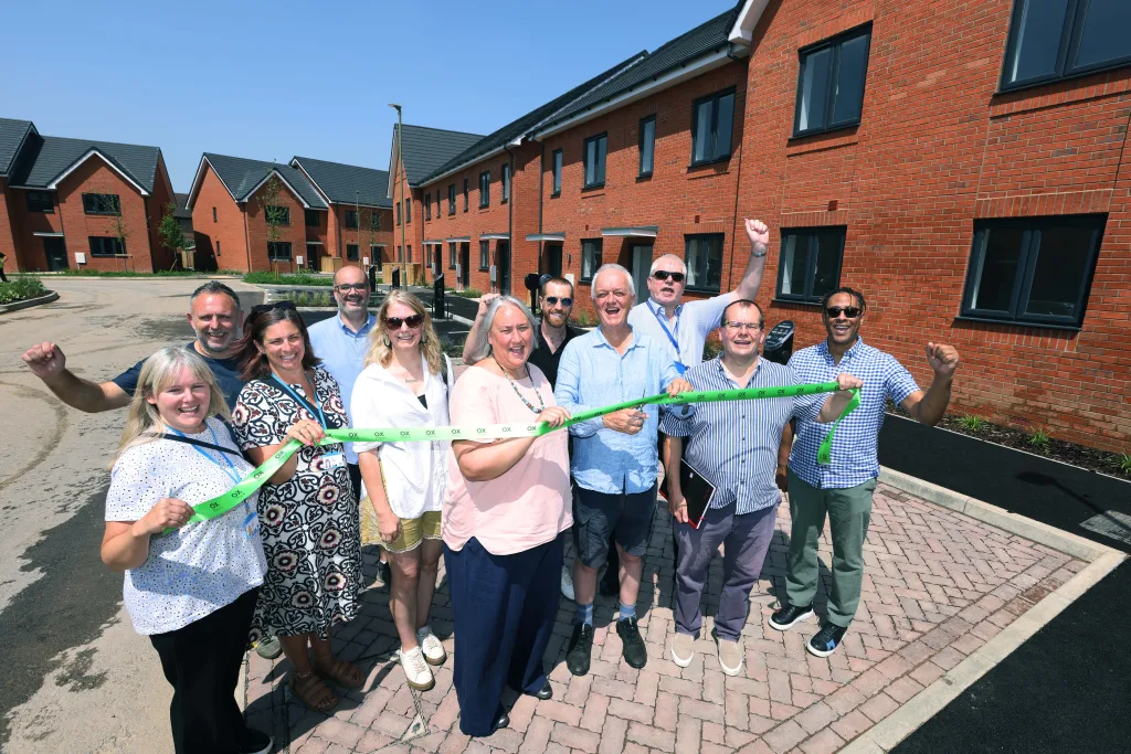Team members from OX Place celebrating the ribbon cutting at Keepers Place